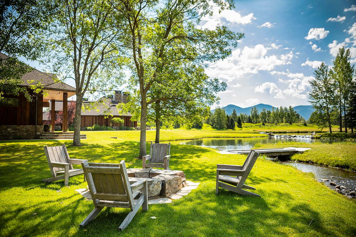 beautiful backyard fire pit with creek