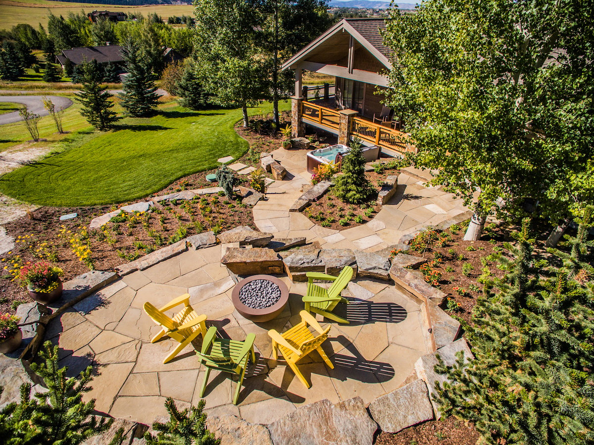 flagstone patio with firepit and hot tub