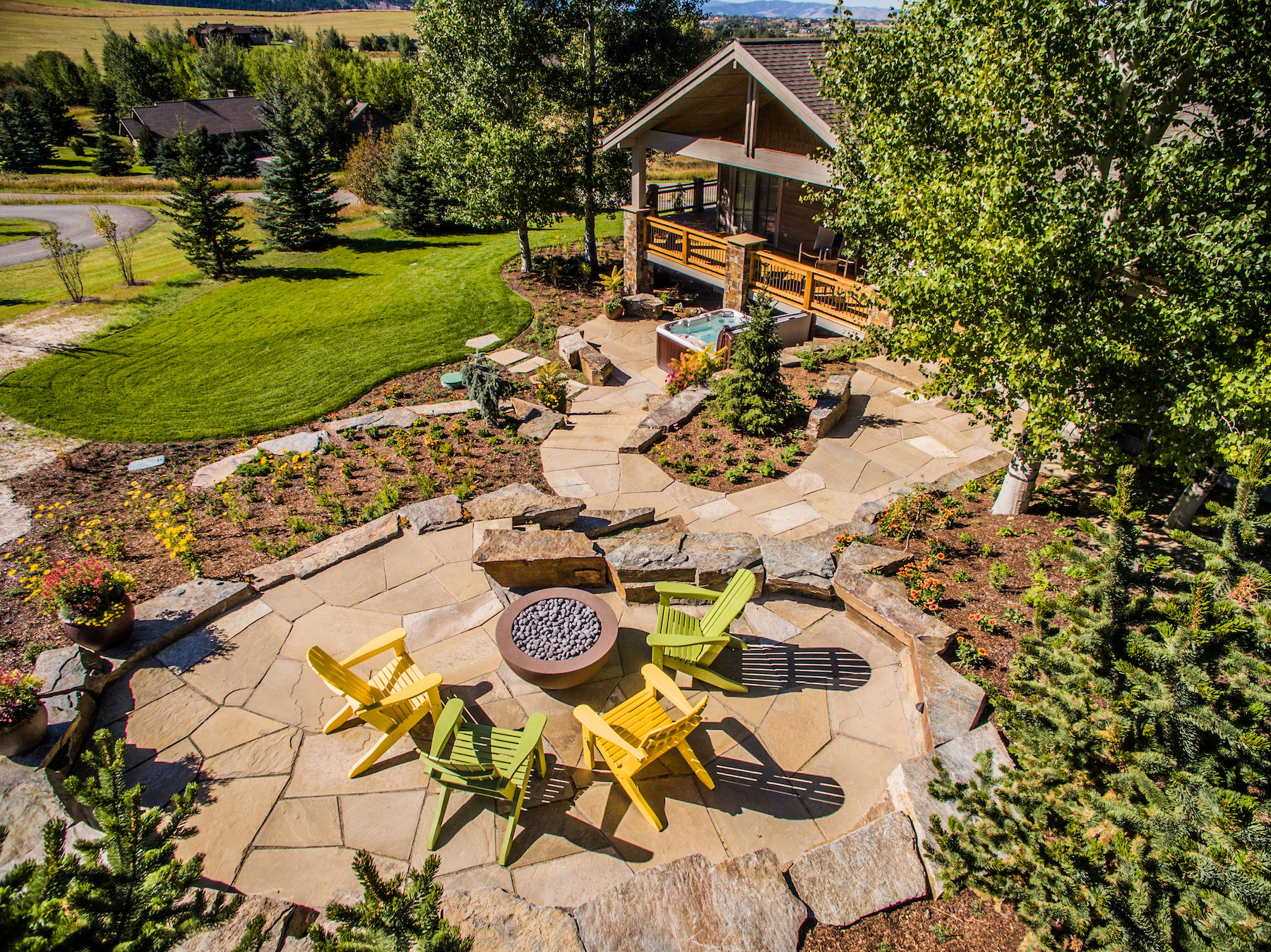 Outdoor natural stone patio and gas fire pit