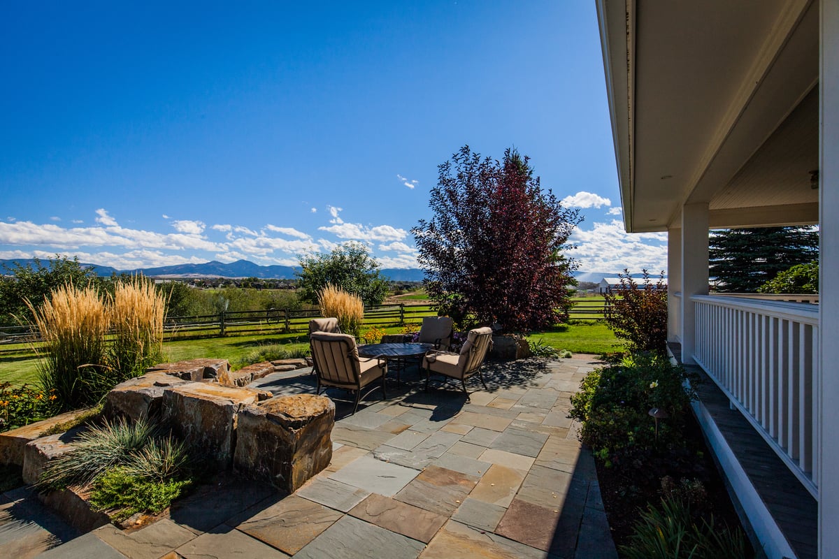 bluestone patio with rock wall and firepit