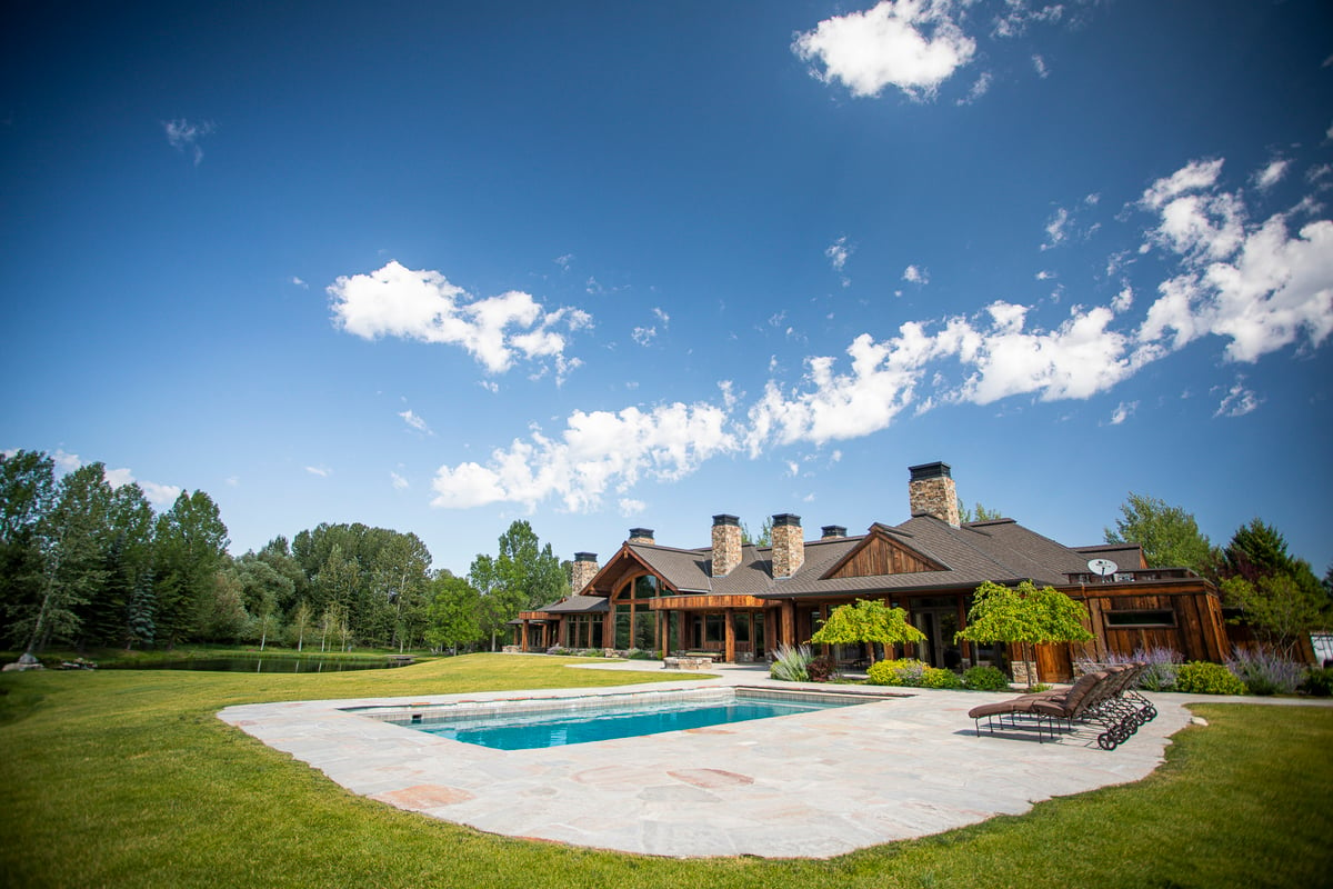 natural stone patio around pool