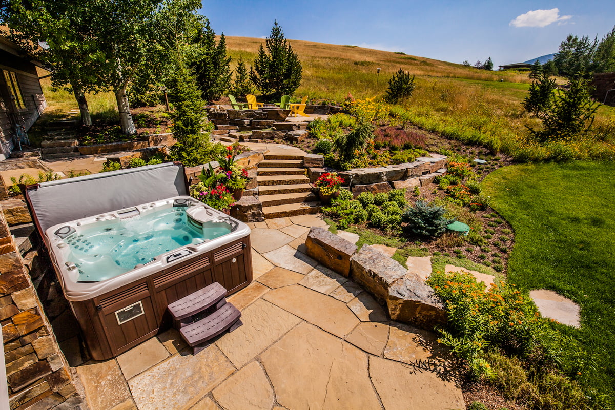 hot tub on natural stone patio