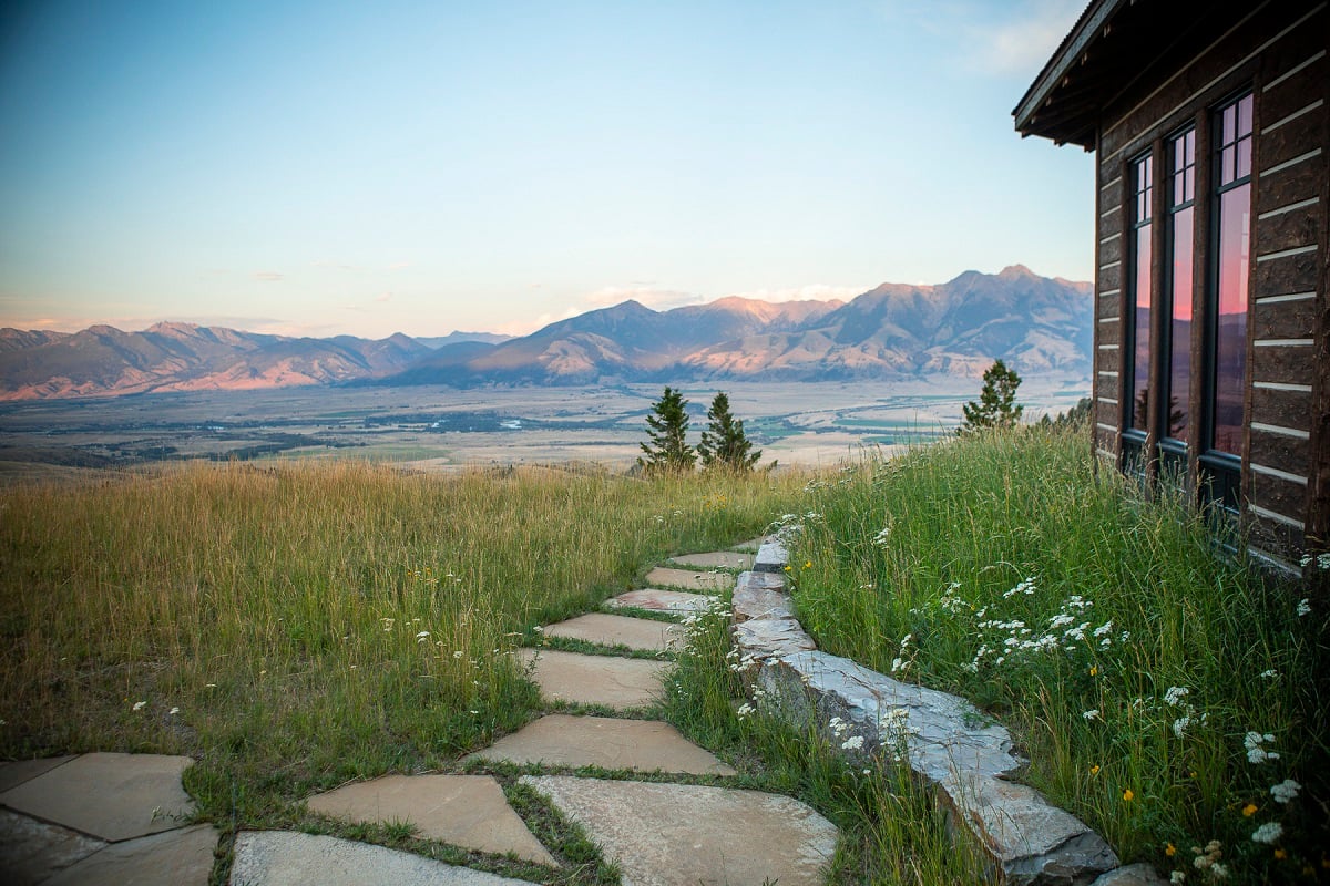 walkway near house with meadow overlooking moutains