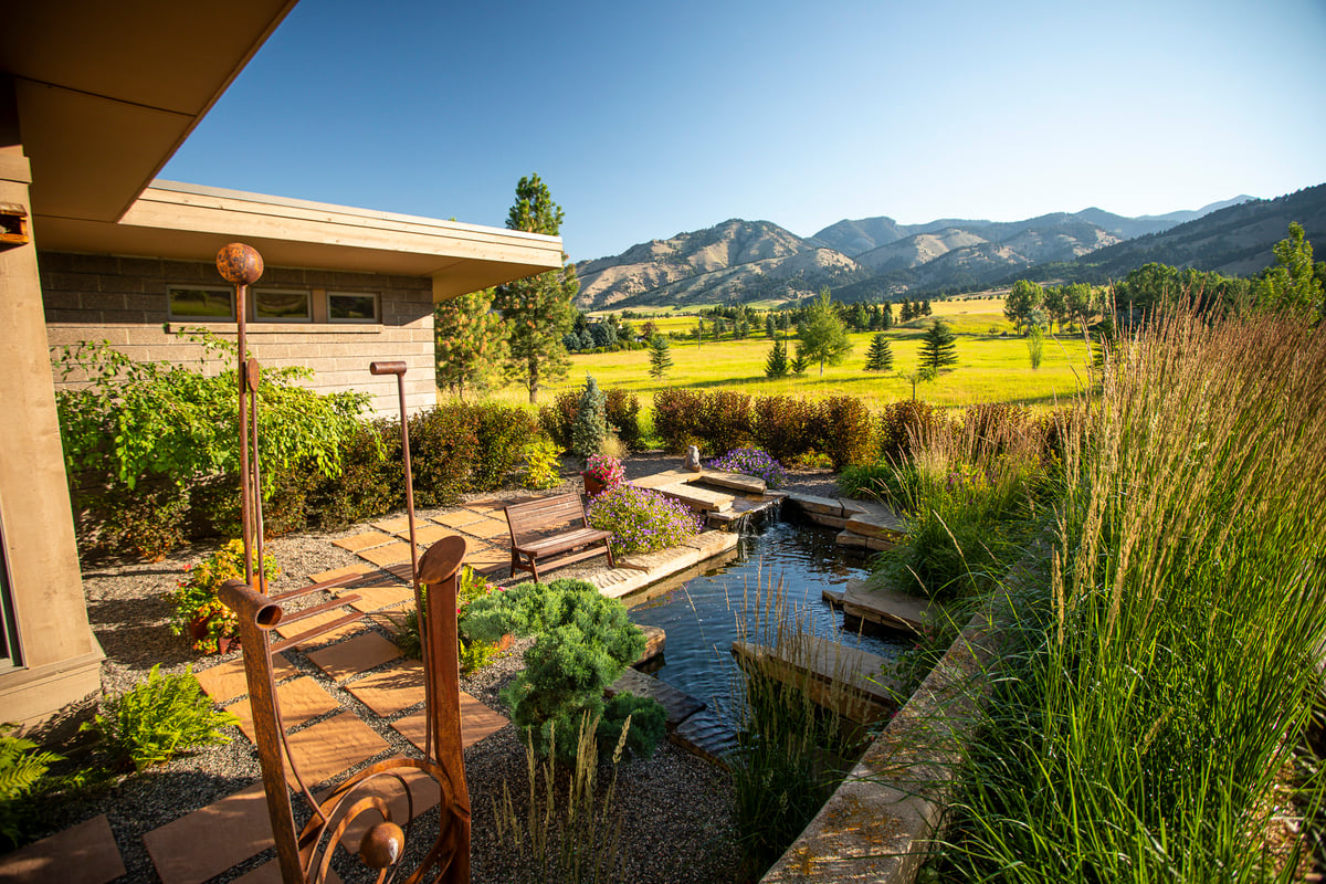 pond water feature with bench and moutains