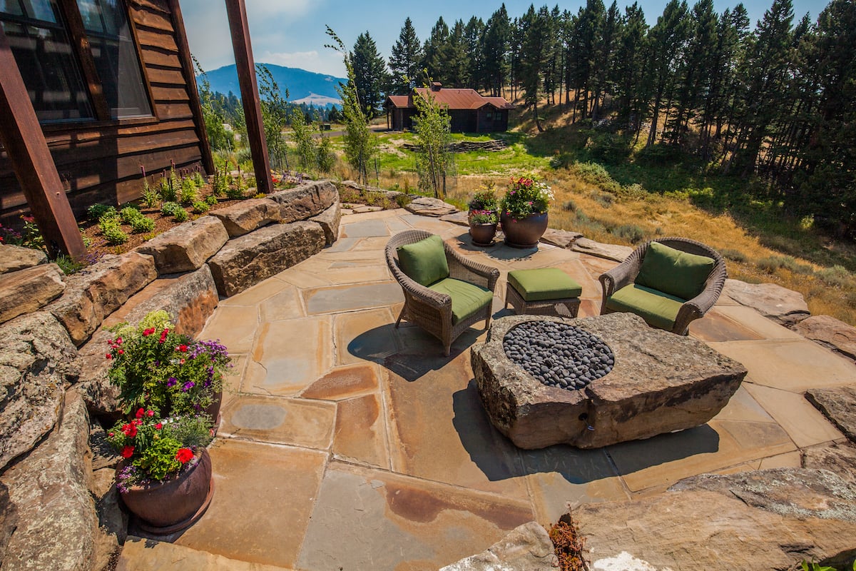 Patio in Montana with gas fire pit natural stone