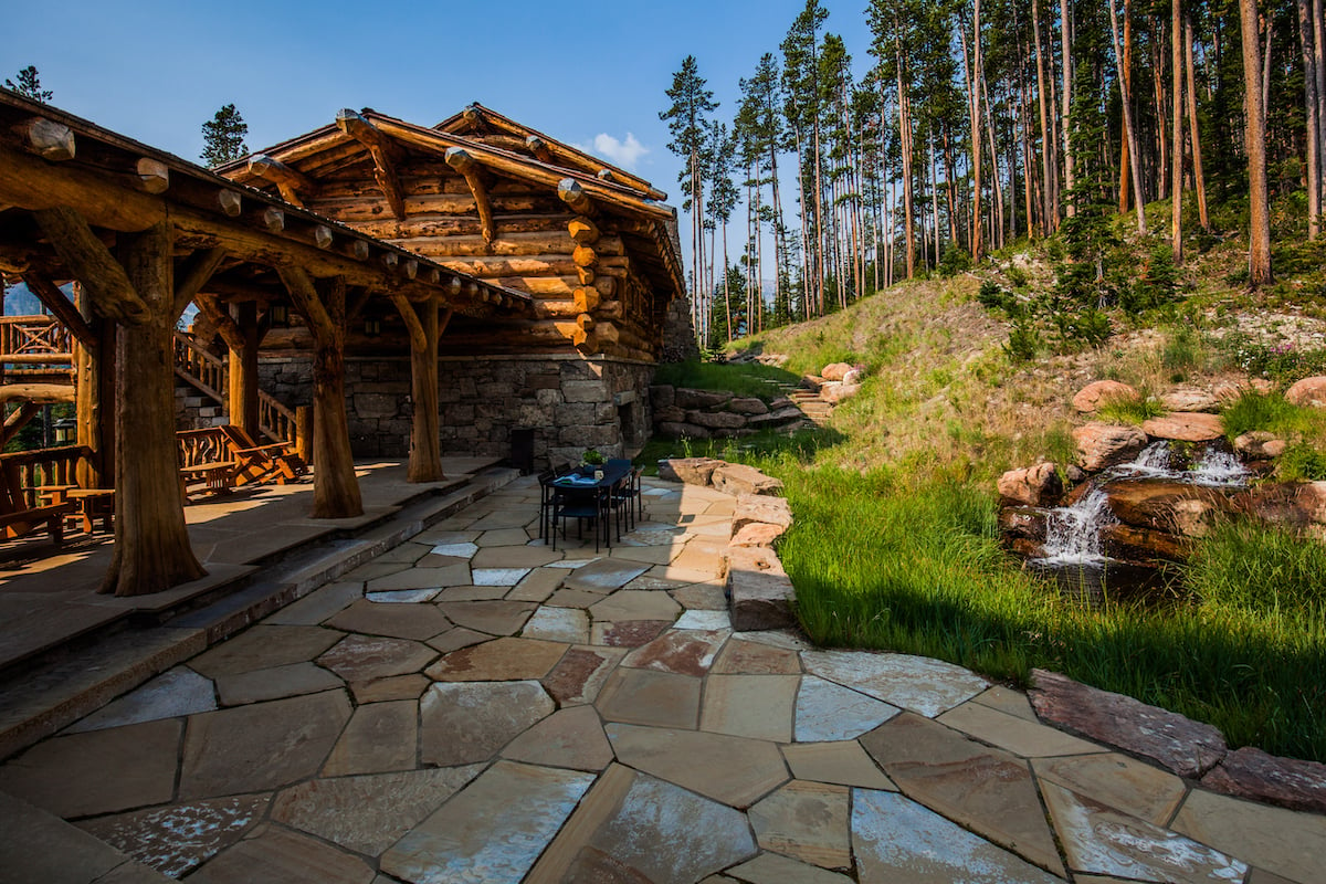 beautiful patio with natural stone and waterfall