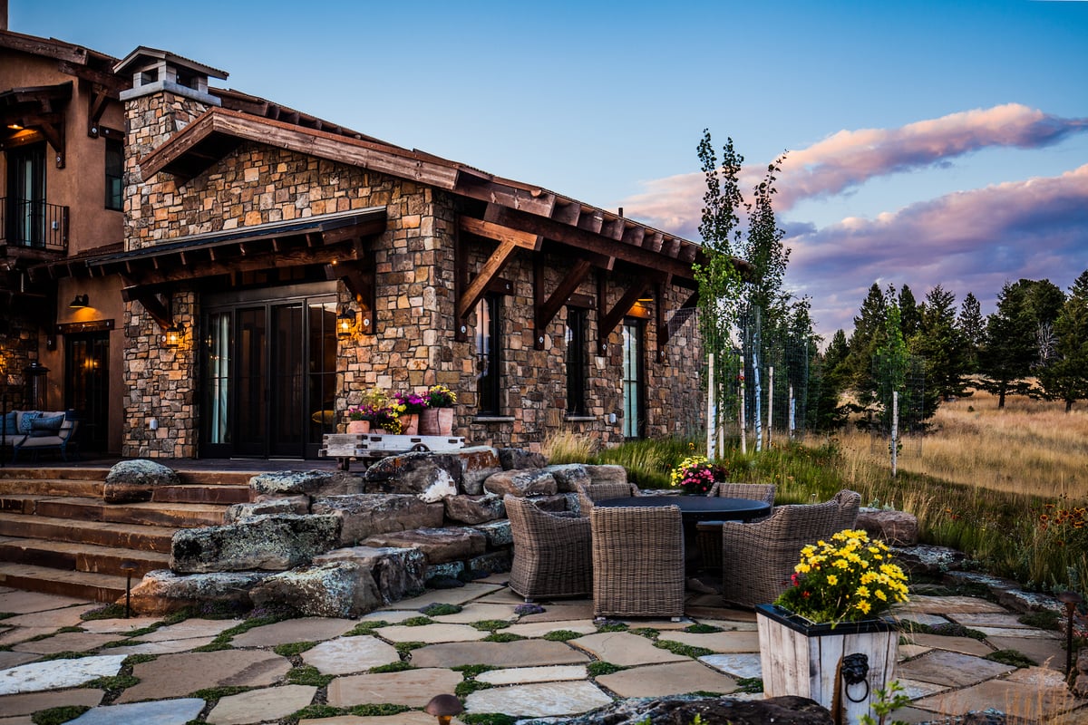 flagstone patio with stone steps and plantings