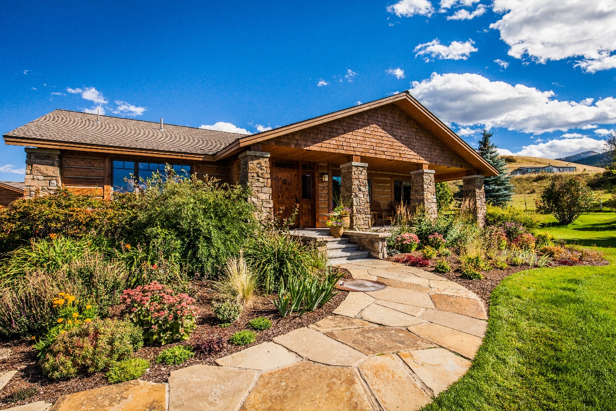 flagstone walkway to entrance of home with beautiful plantings