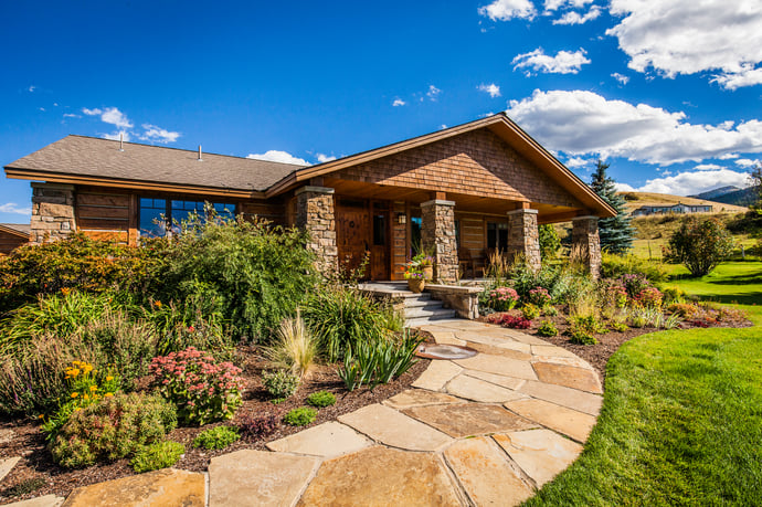 walkway with pruned shrubs and plants