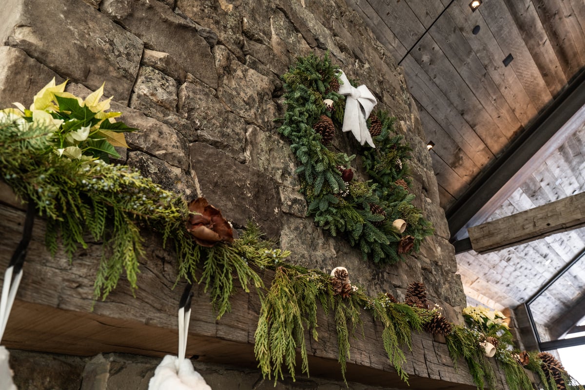 live garland and wreath on mantel for holidays