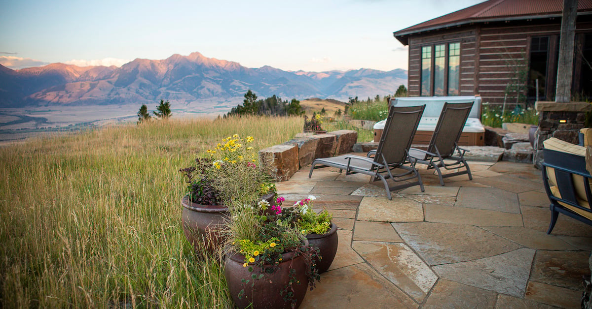 flagstone patio with hot tub overlooking moutains