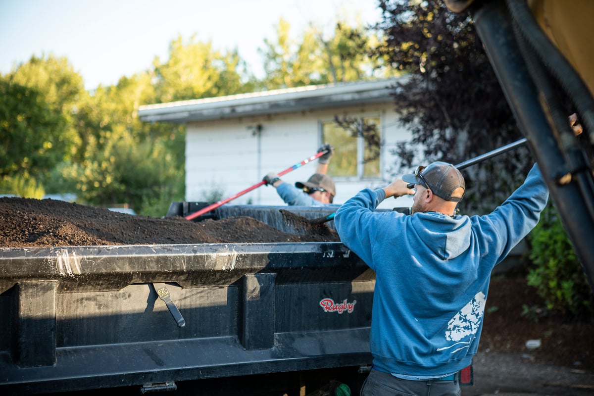 landscape crew loading truck with mulch