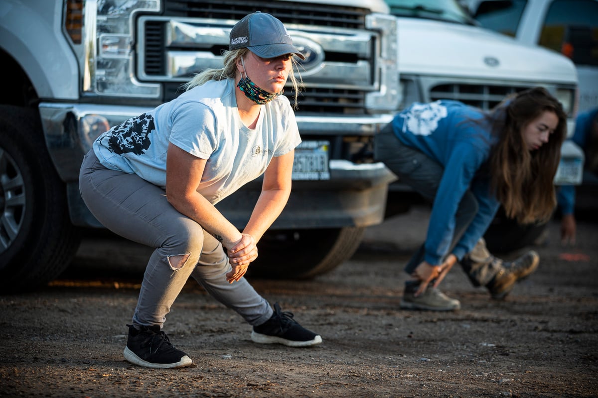 landscape professionals stretch in yard